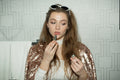 Applying hydrating lip oil